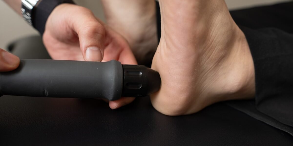 Close-up of a person receiving treatment on their heel.