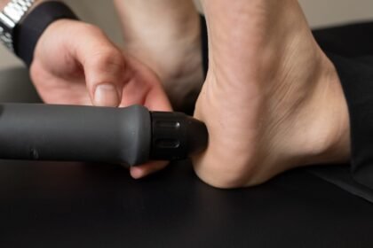 Close-up of a person receiving treatment on their heel.